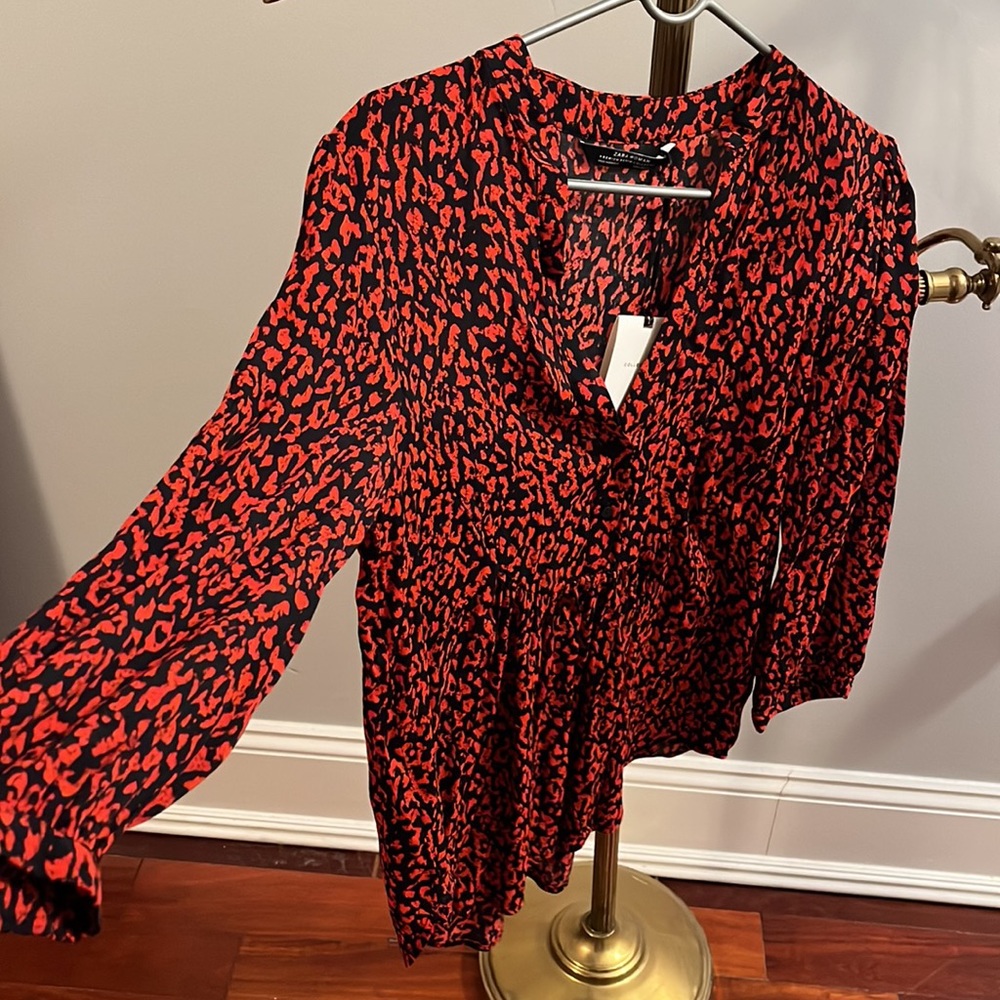 Red leopard print flouncy blouse